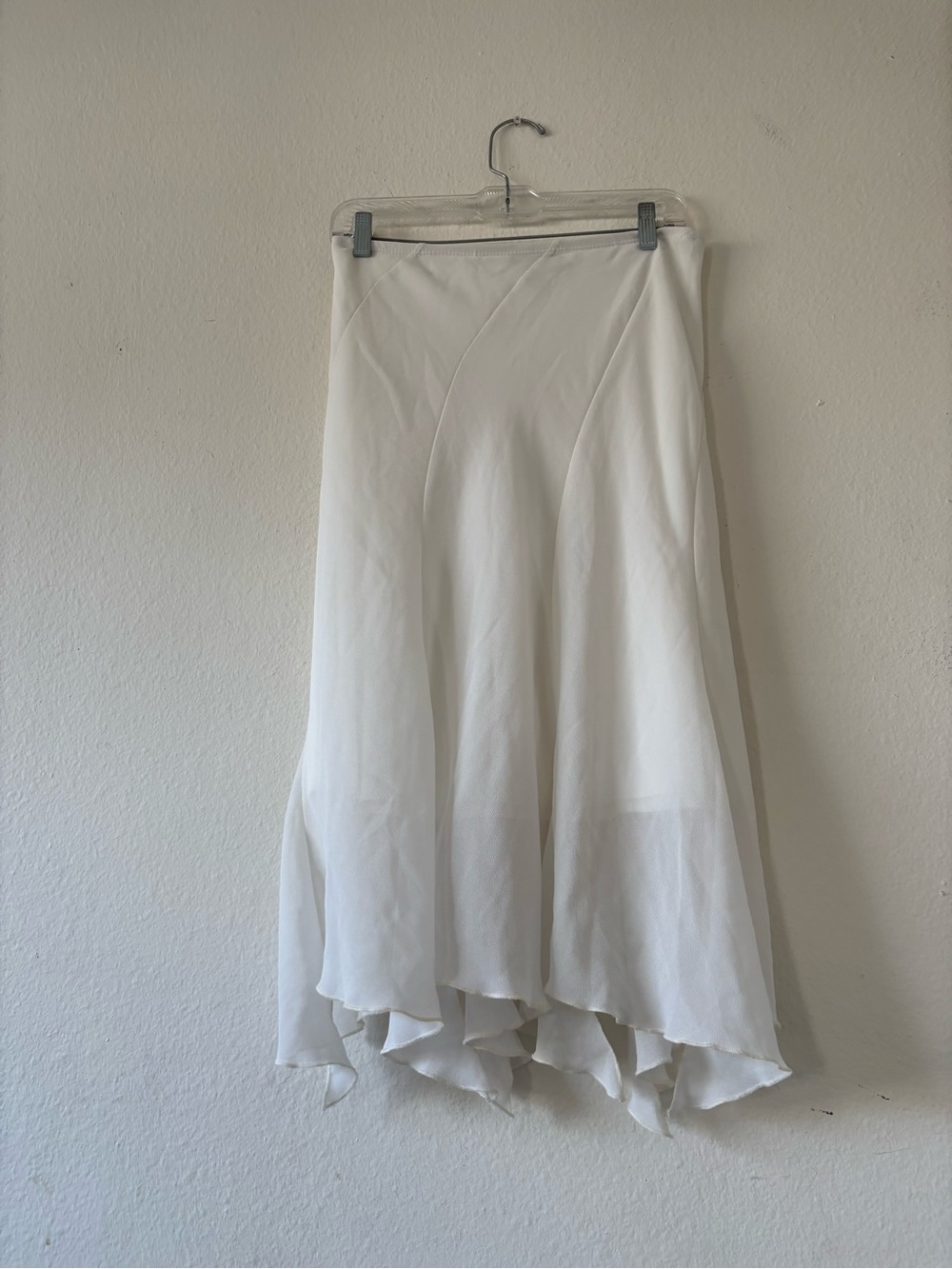 Vintage Asymmetrical White midi skirt with asymmetrical hem and ruffle detail